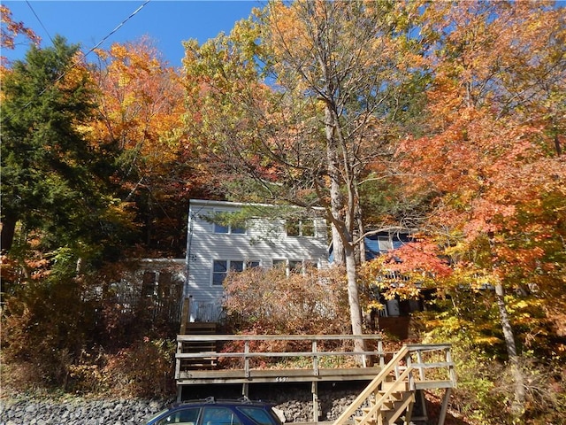 dock area with stairs and a wooden deck