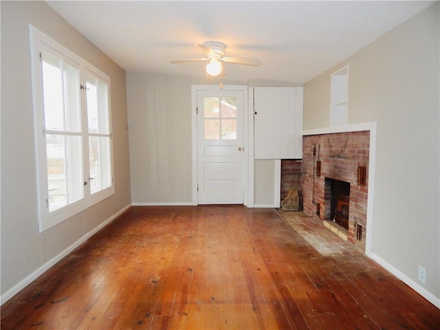 6691 State Highway 80, Otsego, NY 13326 - unfurnished living room with wood-type flooring, a ceiling fan, and a fireplace