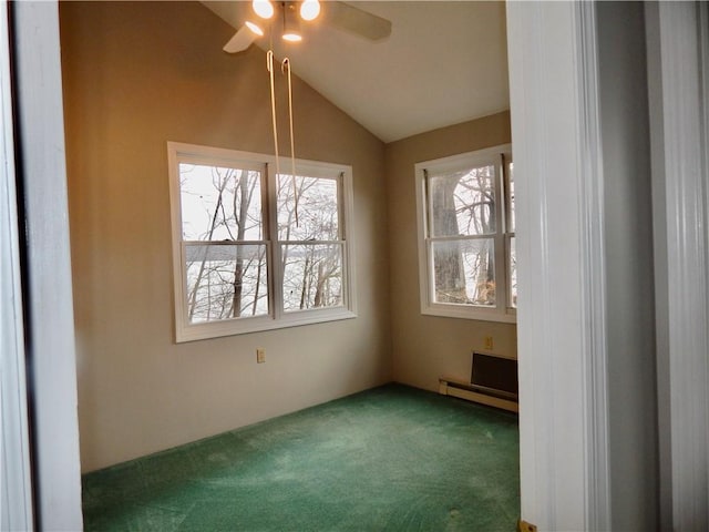 carpeted empty room featuring a ceiling fan and vaulted ceiling