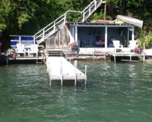 view of dock featuring a water view and stairway