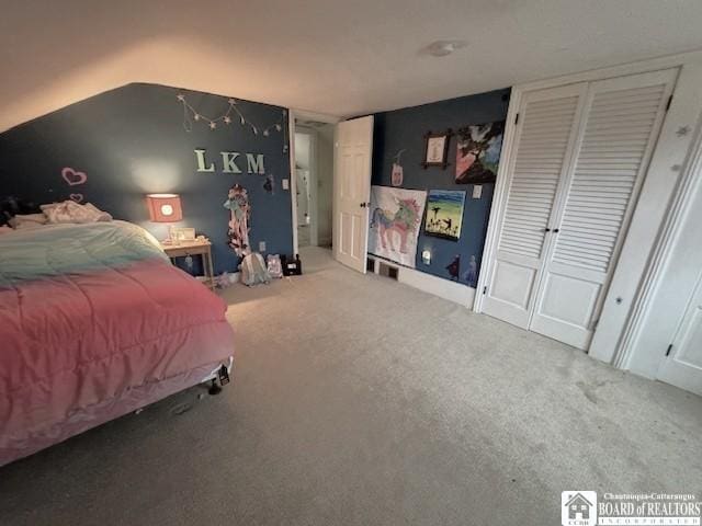 bedroom with carpet flooring and multiple closets