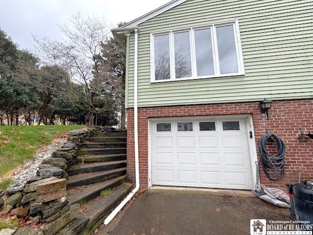 garage featuring driveway