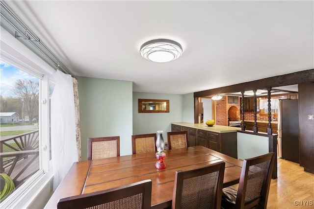 dining space with light wood finished floors