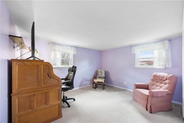 carpeted home office with baseboards