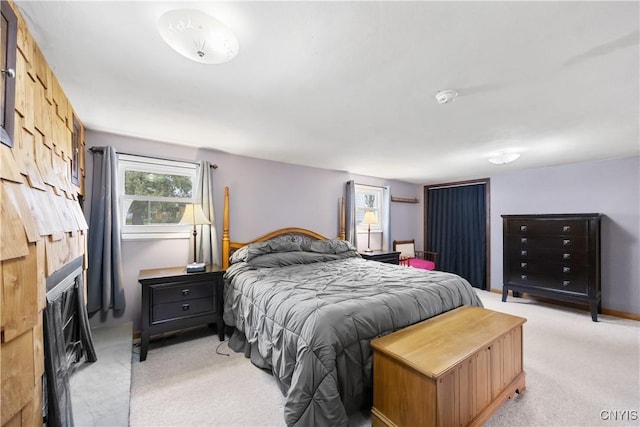 bedroom featuring light carpet