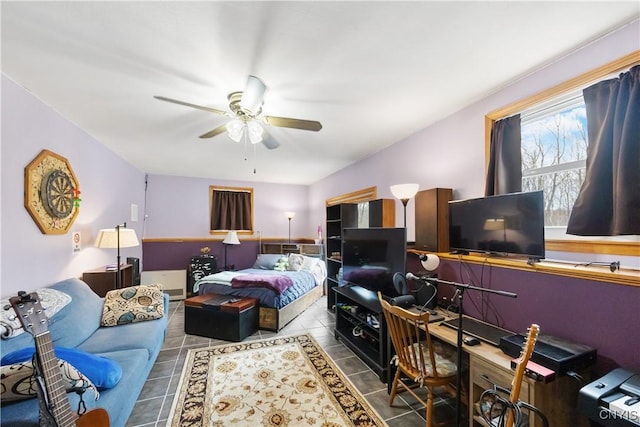 tiled bedroom with ceiling fan