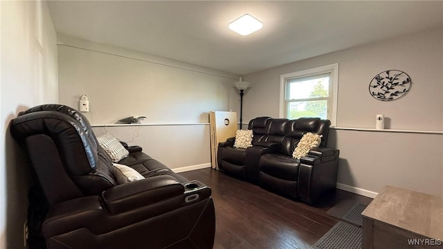 living area with baseboards and dark wood-style flooring