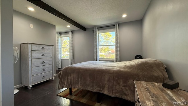 bedroom featuring recessed lighting, baseboards, dark wood finished floors, and beam ceiling