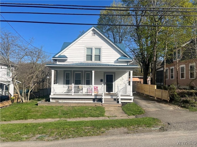 122 Main St, Hanover, NY 14136 - view of front of house featuring covered porch, metal roof, and fence