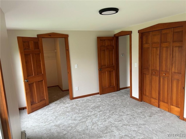 7310 Milestrip Rd, Orchard Park, NY 14127 - unfurnished bedroom with carpet floors, a closet, and baseboards