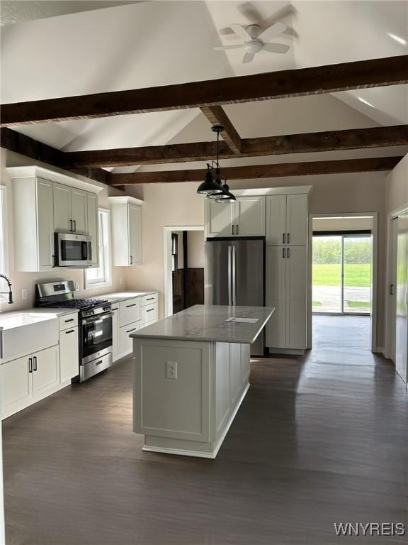 7310 Milestrip Rd, Orchard Park, NY 14127 - kitchen featuring a ceiling fan, appliances with stainless steel finishes, a sink, dark wood-type flooring, and beam ceiling