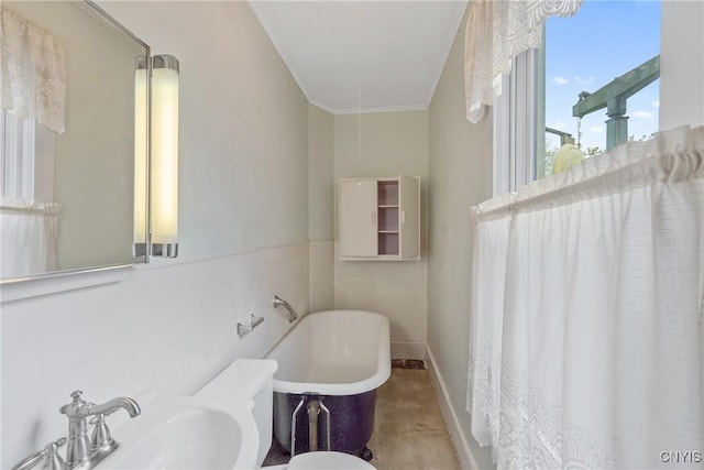 bathroom with a sink and a freestanding bath