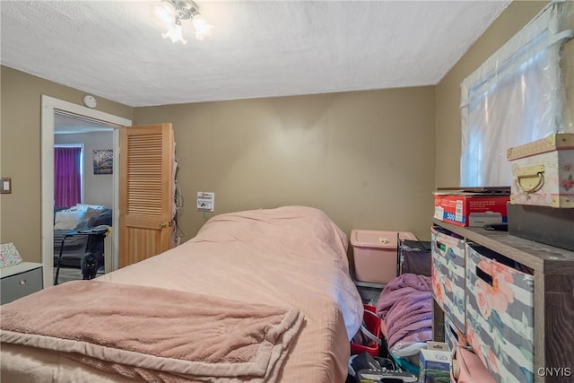 bedroom featuring a textured ceiling