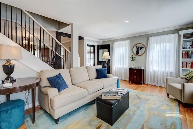 living area featuring crown molding, recessed lighting, stairs, and wood finished floors
