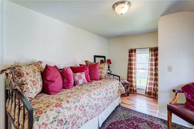 bedroom with wood finished floors