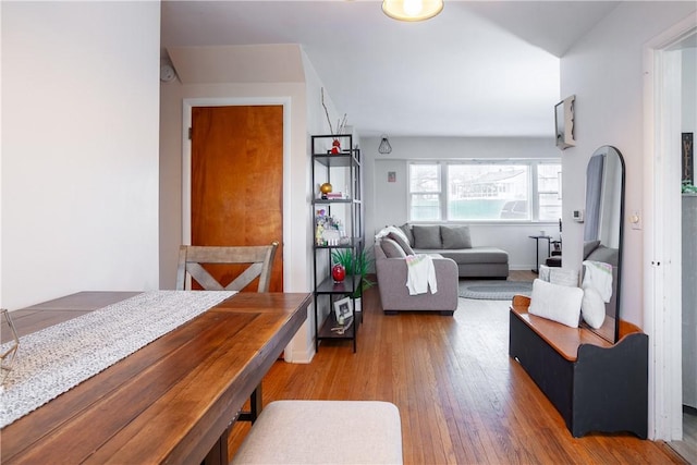dining area featuring baseboards and wood finished floors