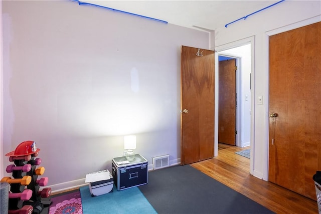 interior space with baseboards and visible vents