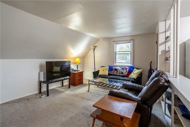 living area featuring light colored carpet, baseboards, and vaulted ceiling