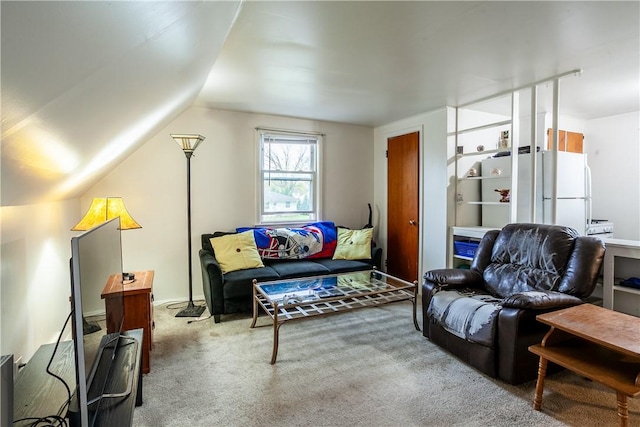 carpeted living room featuring lofted ceiling