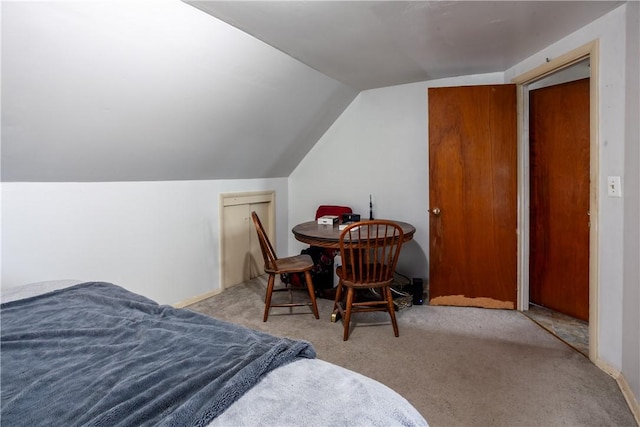 carpeted bedroom with vaulted ceiling