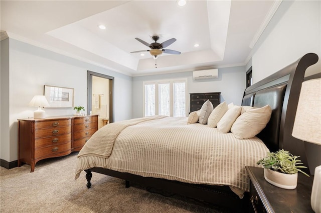 bedroom featuring an AC wall unit, carpet, a raised ceiling, and recessed lighting
