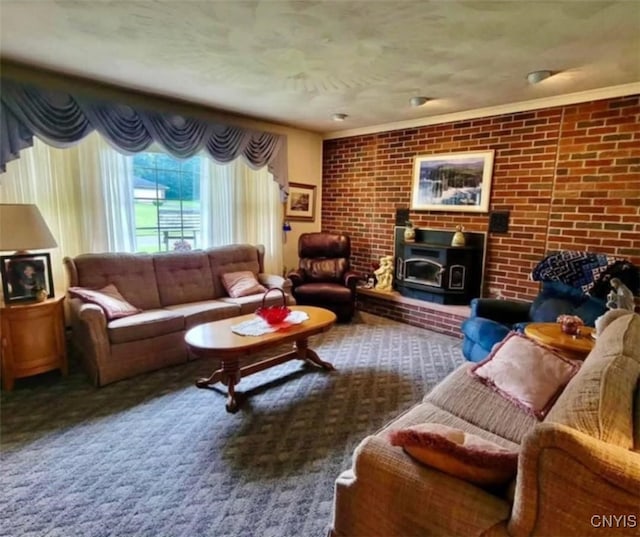 living area featuring a wood stove and brick wall