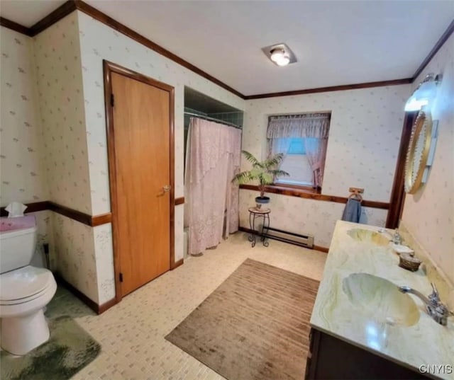 bathroom with double vanity, ornamental molding, toilet, wallpapered walls, and a baseboard radiator