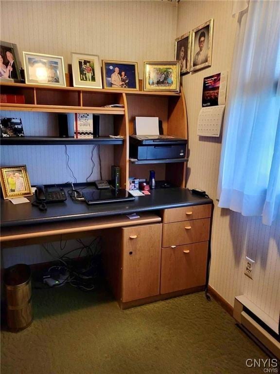 office area with carpet, baseboard heating, and built in desk