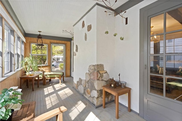 sunroom / solarium featuring hardwood / wood-style flooring