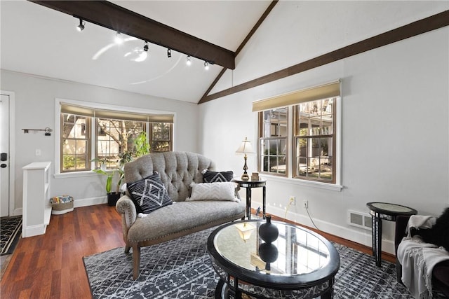 living room with track lighting, baseboards, wood finished floors, and vaulted ceiling with beams