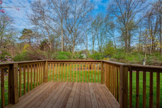 wooden deck with a lawn