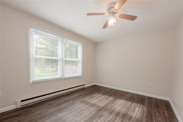 empty room with wood finished floors, a ceiling fan, baseboards, and a baseboard heating unit