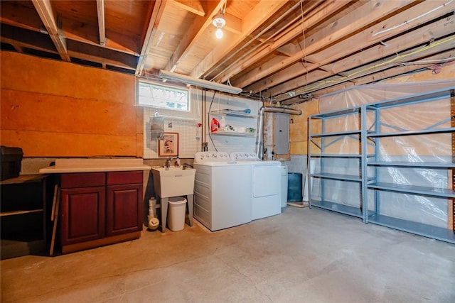 below grade area featuring separate washer and dryer and electric panel