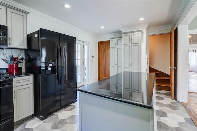 kitchen featuring crown molding, dark countertops, gray cabinets, recessed lighting, and black appliances