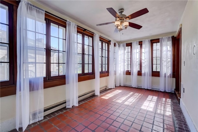 unfurnished sunroom with baseboards, tile patterned floors, and french doors
