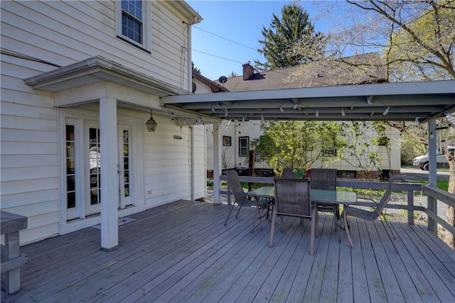 wooden terrace with outdoor dining area