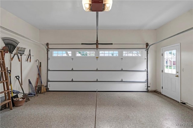 garage featuring a garage door opener