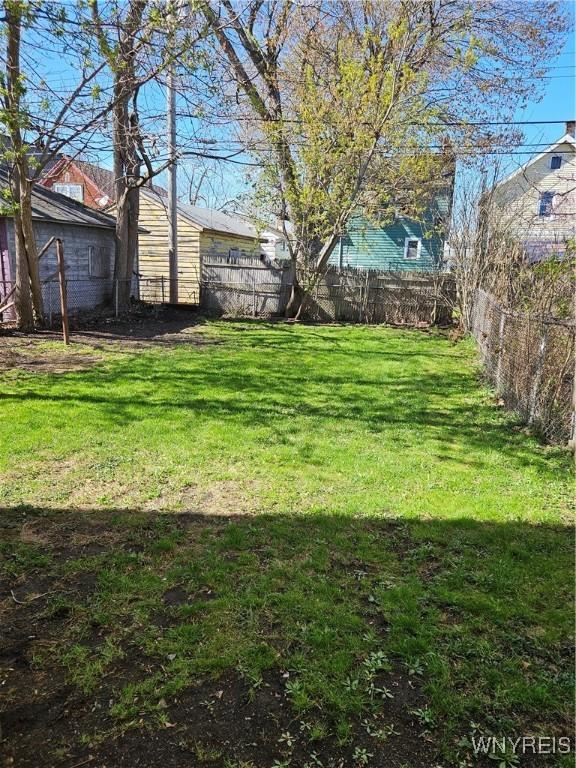 view of yard featuring fence
