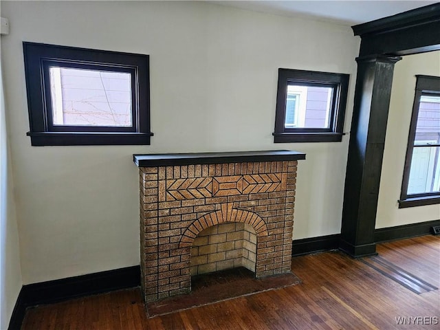details featuring baseboards and wood finished floors