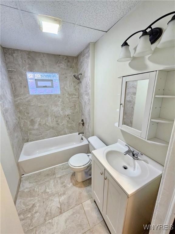full bath with vanity, toilet, and tub / shower combination