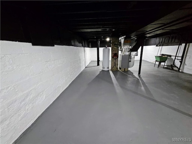 unfinished basement with heating unit and gas water heater