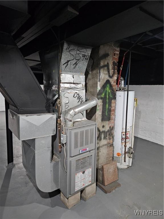 utility room with gas water heater