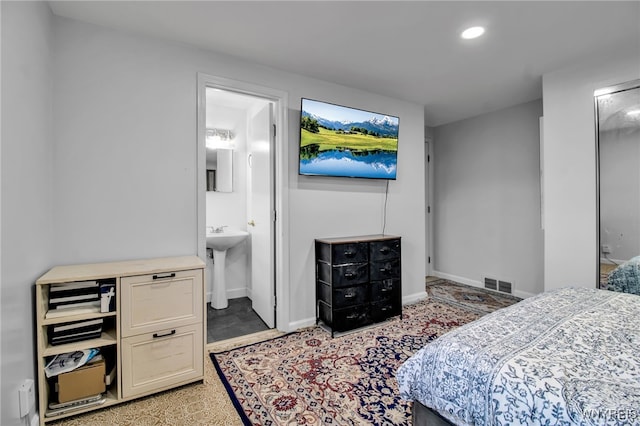 bedroom featuring visible vents, recessed lighting, baseboards, and ensuite bath