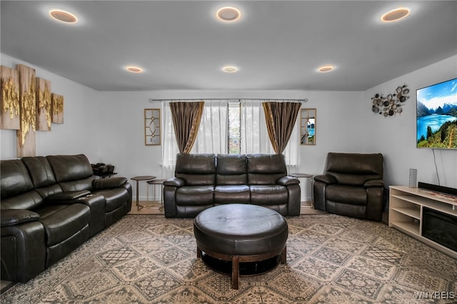 living area with recessed lighting and baseboards