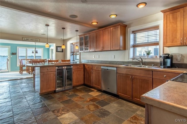 21959 County Route 59, Brownville, NY 13634 - kitchen featuring stainless steel dishwasher, a sink, a peninsula, stone tile flooring, and wine cooler