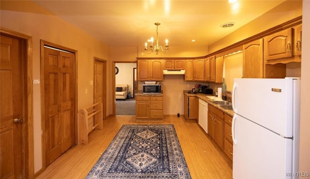 723 Pine Ave, Niagara Falls, NY 14301 - kitchen featuring white appliances, a notable chandelier, under cabinet range hood, and light wood-style floors