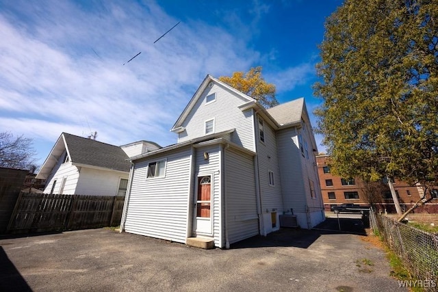 723 Pine Ave, Niagara Falls, NY 14301 - view of side of property featuring central AC and a fenced backyard