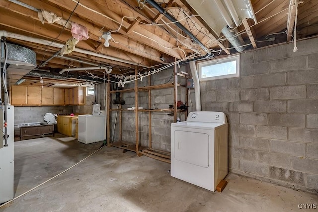 below grade area with washer and clothes dryer