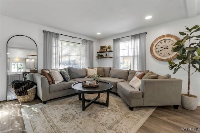 living area featuring recessed lighting and light wood finished floors