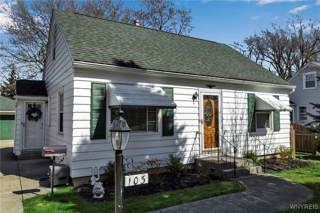 view of front facade featuring a shingled roof